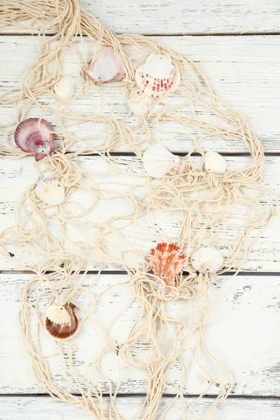 Decor of seashells on wooden table background — Stock Photo, Image