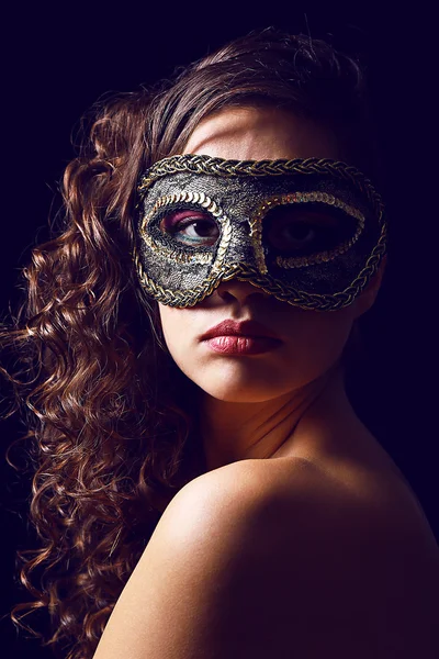 Beautiful girl with masquerade mask on dark background — Stock Photo, Image