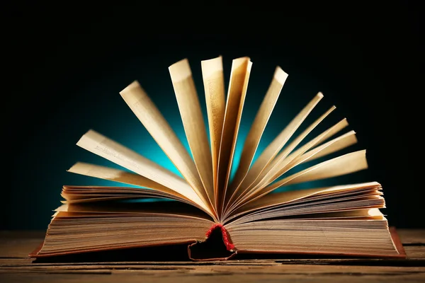 Open book over dark colorful background — Stock Photo, Image