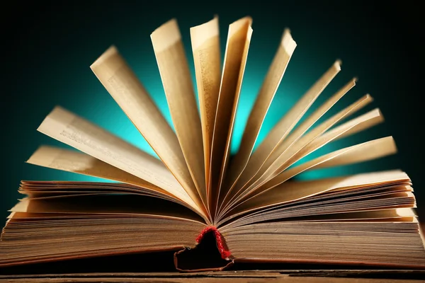 Open book over dark colorful background — Stock Photo, Image