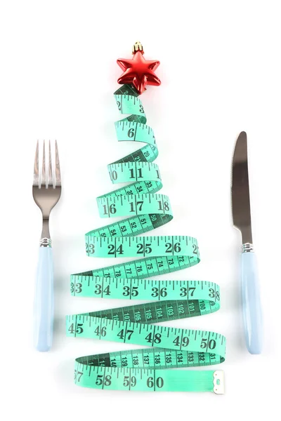 Fita de medição e talheres com decoração de Natal isolados em branco — Fotografia de Stock