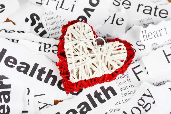 Decorative wicker  heart on background of paper notes — Stock Photo, Image