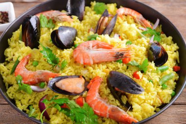 Seafood Paella in pan clipart