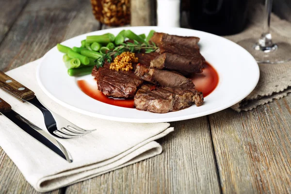 Steak with wine sauce — Stock Photo, Image