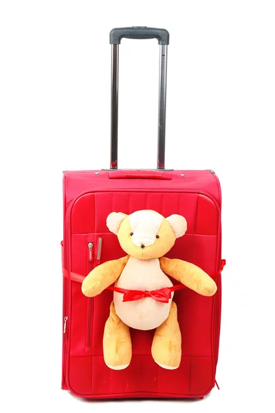 Red suitcase with toy teddy bear isolated on white — Stock Photo, Image