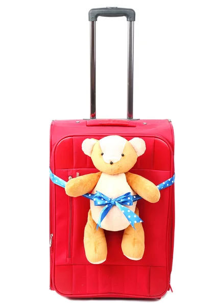 Red suitcase with toy teddy bear isolated on white — Stock Photo, Image
