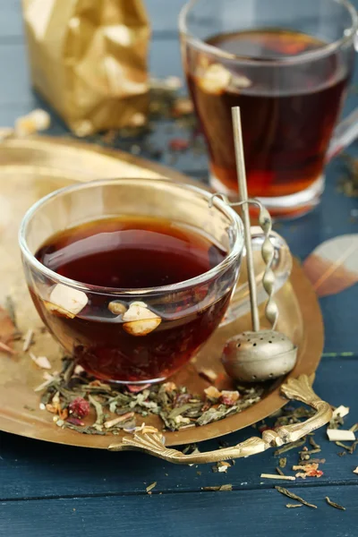 Beautiful vintage composition with herbal tea, on wooden table — Stock Photo, Image