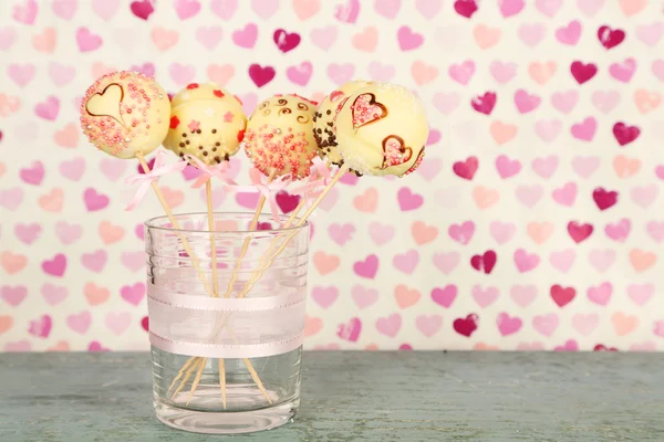 Tasty cake pops on color background — Stock Photo, Image