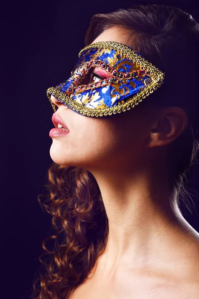 Beautiful girl with masquerade mask on dark background — Stock Photo, Image