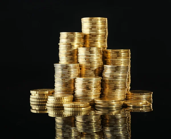 Pile of coins on dark background — Stock Photo, Image