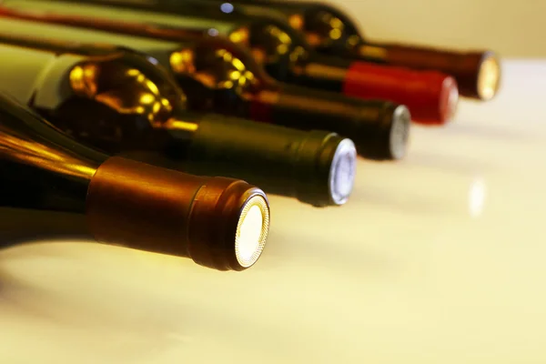 Wine bottles lying in row close-up — Stock Photo, Image