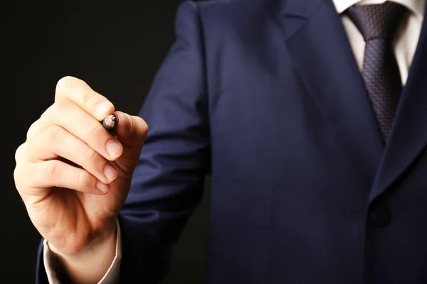 Businessman writing on screen, close-up — Stock Photo, Image