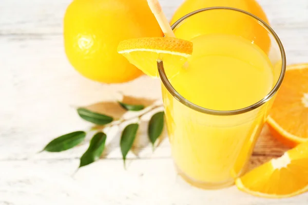 Orange juice with straw — Stock Photo, Image