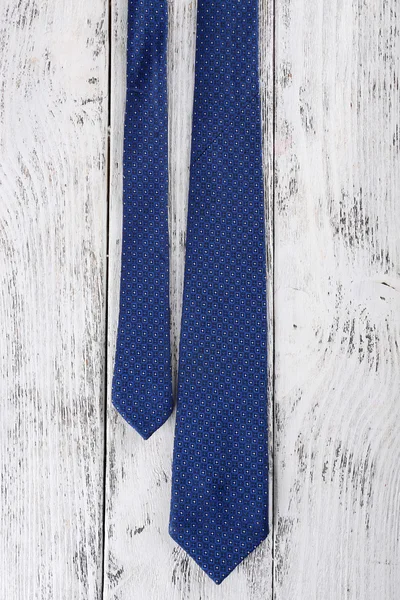 Trendy tie on color wooden background — Stock Photo, Image