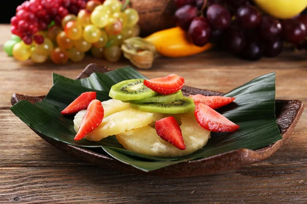 Fruit dessert on green leaf on table — Stock Photo, Image