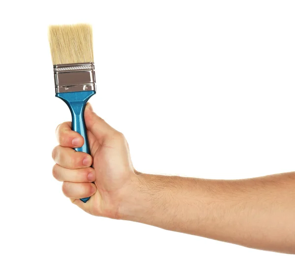 Paintbrush in male hand — Stock Photo, Image