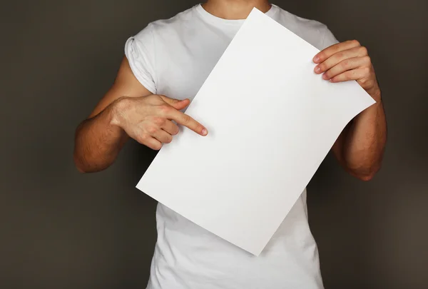 Blank paper in male hands — Stock Photo, Image