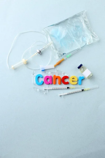 Medicines with word Cancer on light background — Stock Photo, Image