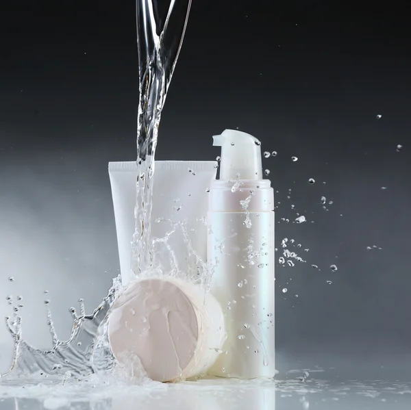 Cosmetic products in water splashes