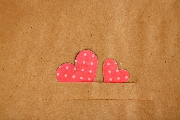 Paper hearts on brown background, close up — Stock Photo, Image