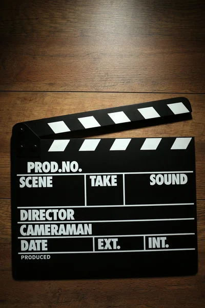 Movie clapper on wooden background — Stock Photo, Image