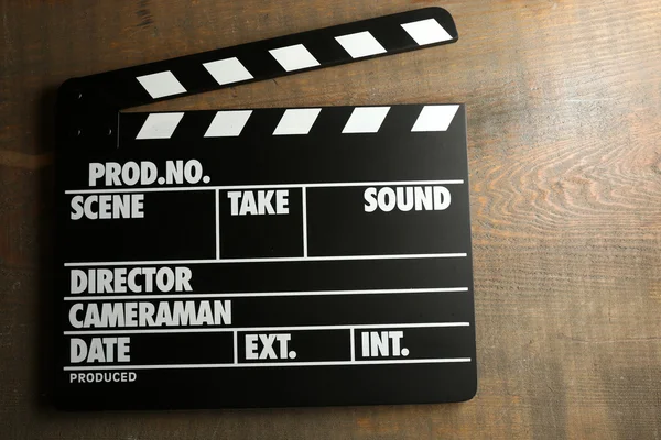 Movie clapper on wooden background — Stock Photo, Image