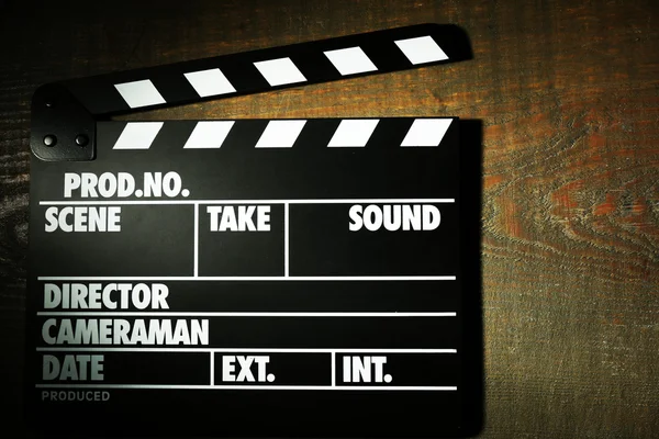 Movie clapper on wooden background — Stock Photo, Image