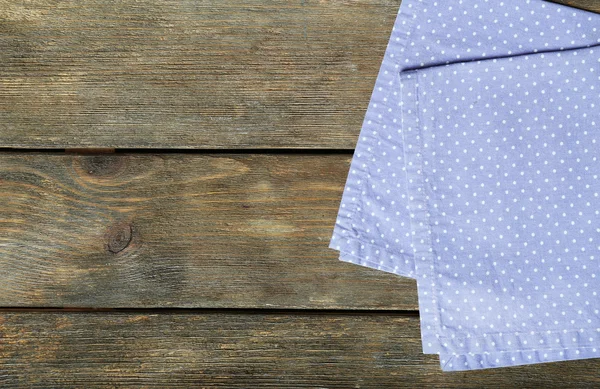 Napkin on wooden table — Stock Photo, Image