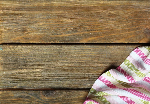 Napkin on wooden table — Stock Photo, Image