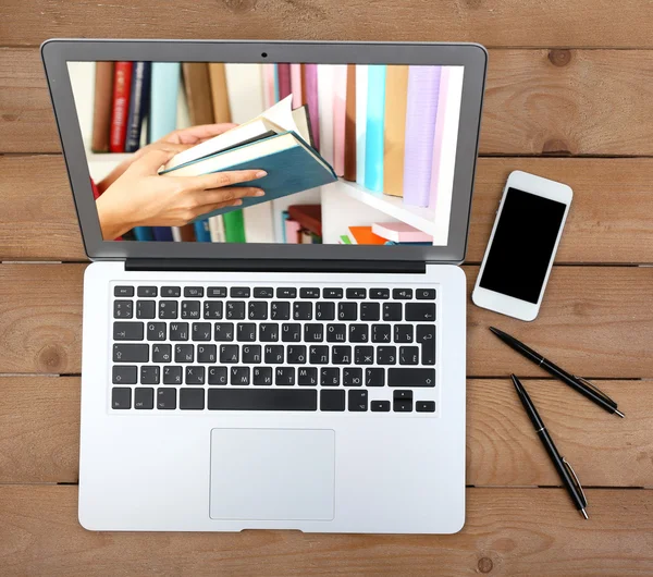 E-learning concept.  Digital library - books inside laptop — Stock Photo, Image