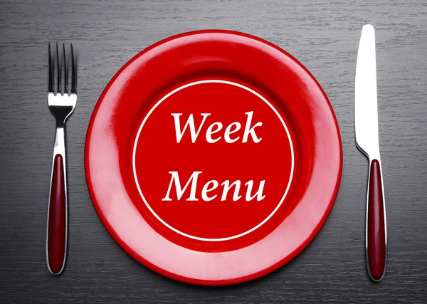 Plaat met tekst "Week Menu", vork en mes op tabelachtergrond — Stockfoto