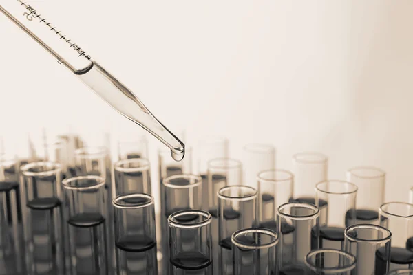 Test-tubes in shades of grey, close-up — Stock Photo, Image