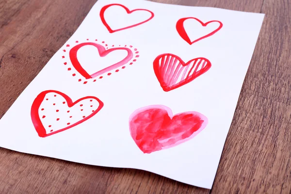 Painted hearts on sheet — Zdjęcie stockowe