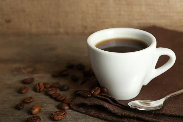 Cup of coffee with beans — Stock Photo, Image