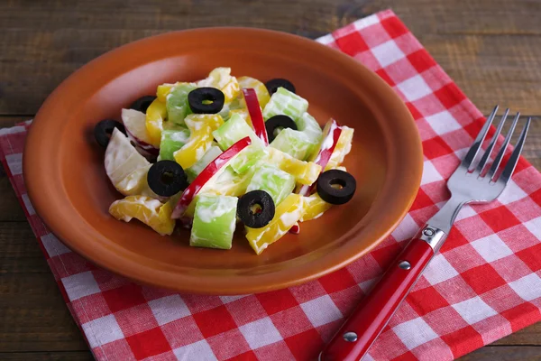 Waldorf salad with olive on plate on table close up — Stock Photo, Image