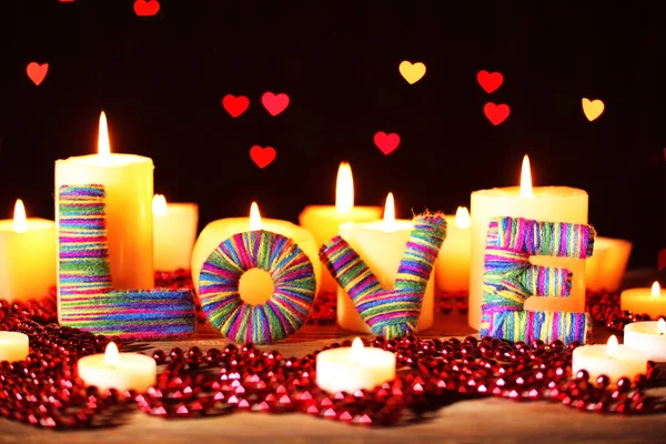 Romantic gift with candles on lights background, love concept — Stock Photo, Image