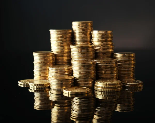 Pile of coins on dark background — Stock Photo, Image