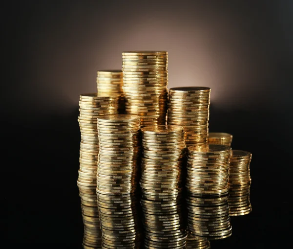 Pile of coins on dark background — Stock Photo, Image