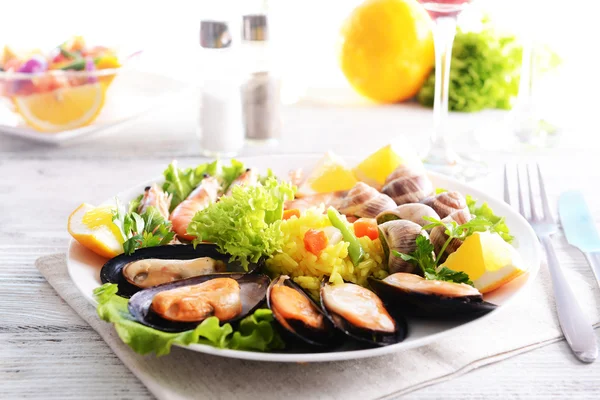 Seafood Paella on plate on table close-up — Stock Photo, Image