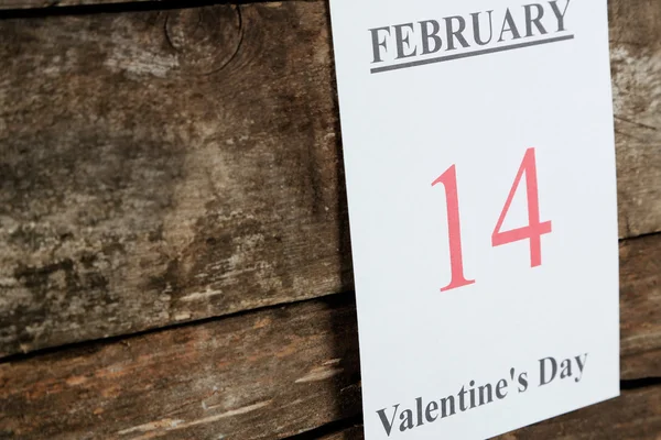 Valentines Day, February 14 on calendar on wooden background — Stock Photo, Image