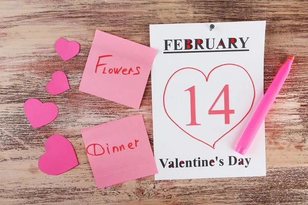 Valentines Day, February 14 on calendar on wooden background — Stock Photo, Image