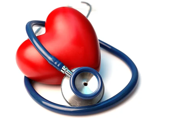 Stethoscope with heart on light background — Stock Photo, Image