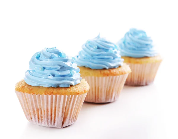 Delicious cupcakes isolated on white — Stock Photo, Image