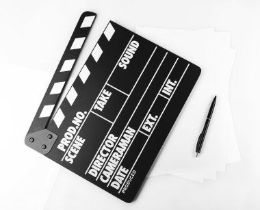 Movie clapper with sheets of paper and pen on white background clipart