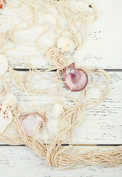 Decor of seashells on wooden table background — Stock Photo, Image