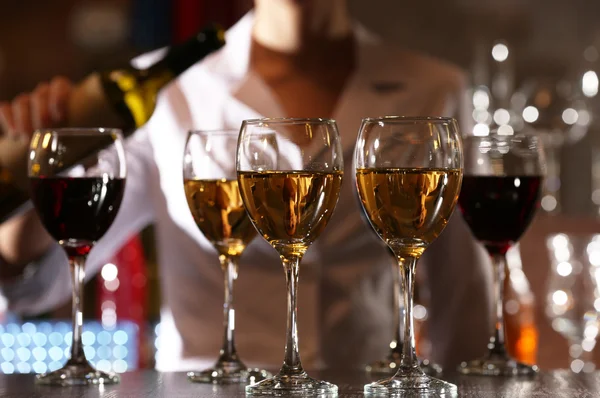 Bartender working at counter on bar background — Stock Photo, Image