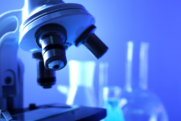 Microscope close-up on color background