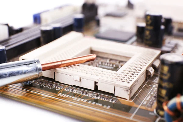 Motherboard repairing on white background — Stock Photo, Image