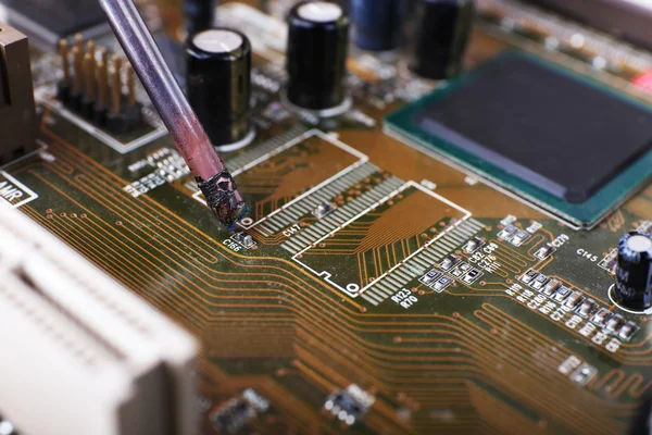 Repairing of motherboard, macro view — Stock Photo, Image