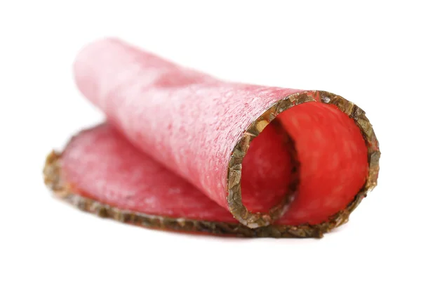 Fetta di salame isolata su fondo bianco — Foto Stock